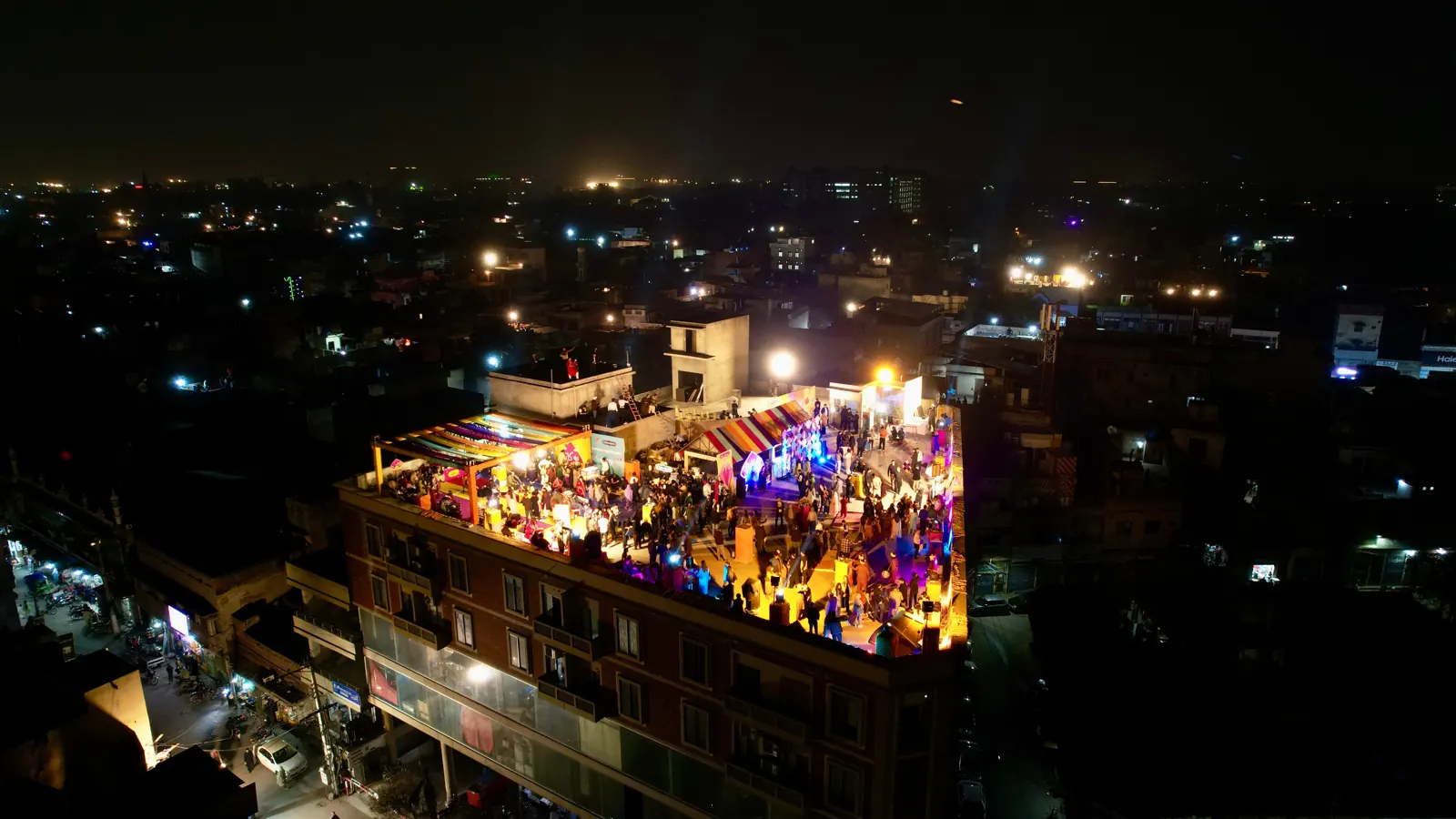 Aerial view of the Cinnabon Basant rooftop at night, Mozang, Lahore