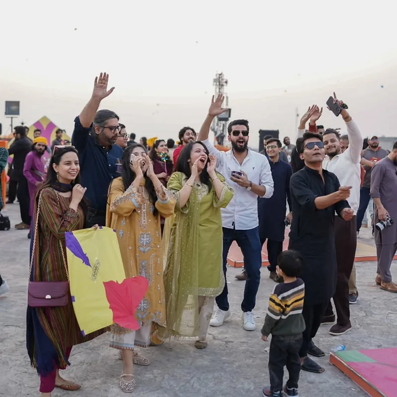 Guests flying kites on the rooftop
